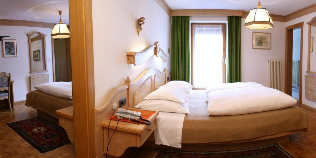 Hotel Dolomiti Madonna Ortisei Szoba fotó
